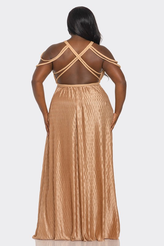 Woman wearing a beige evening gown with a backless design on a white background